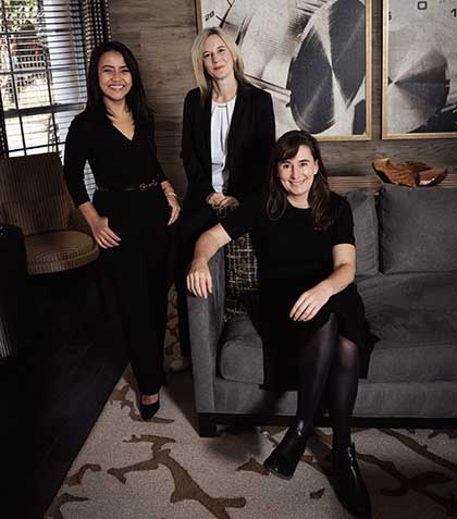 A photo of the three named plaintiffs in Widakuswara v. Lake, the two VOA journalists and one USAGM strategist.