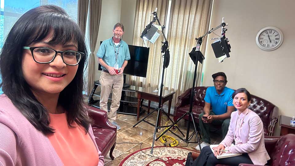 VOA Bangla's Sabrina Choudhury takes a team selfie as David Krupin, Robert Parsell and Service Chief, Satarupa Barua prepare for an interview.
