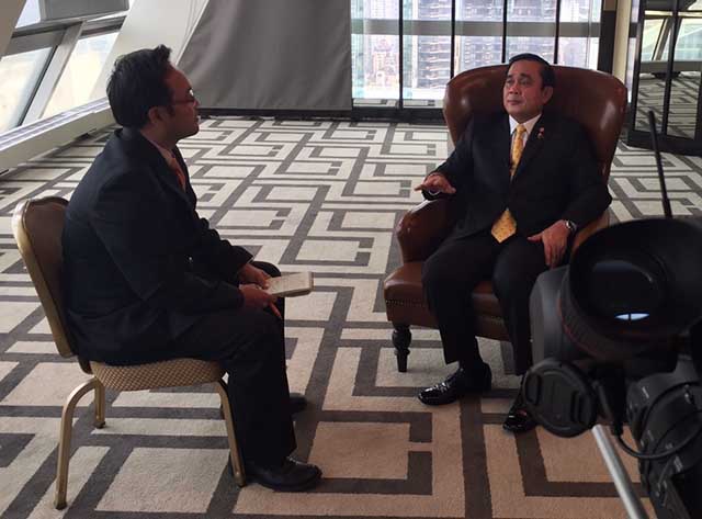 VOA journalist interviews the prime minister of Thailand.