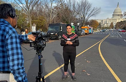 A VOA journalist reports from in front of the U.S. Capitol.