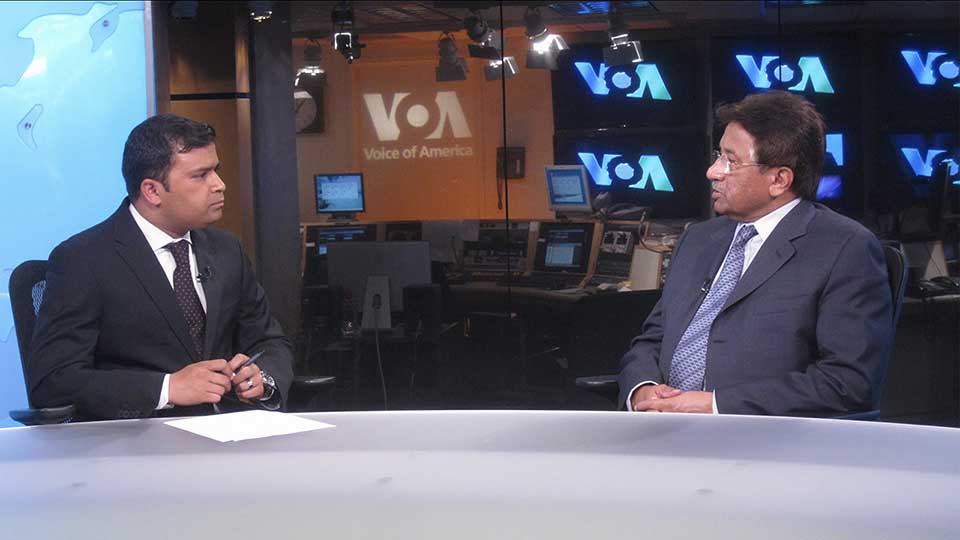 A VOA journalist interviews former Pakistani president Pervez Musharraf in a television studio.