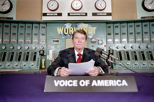 President Reagan gives his weekly radio address, on Saturday, November 9, 1985, at the Voice of America studio in Washington.